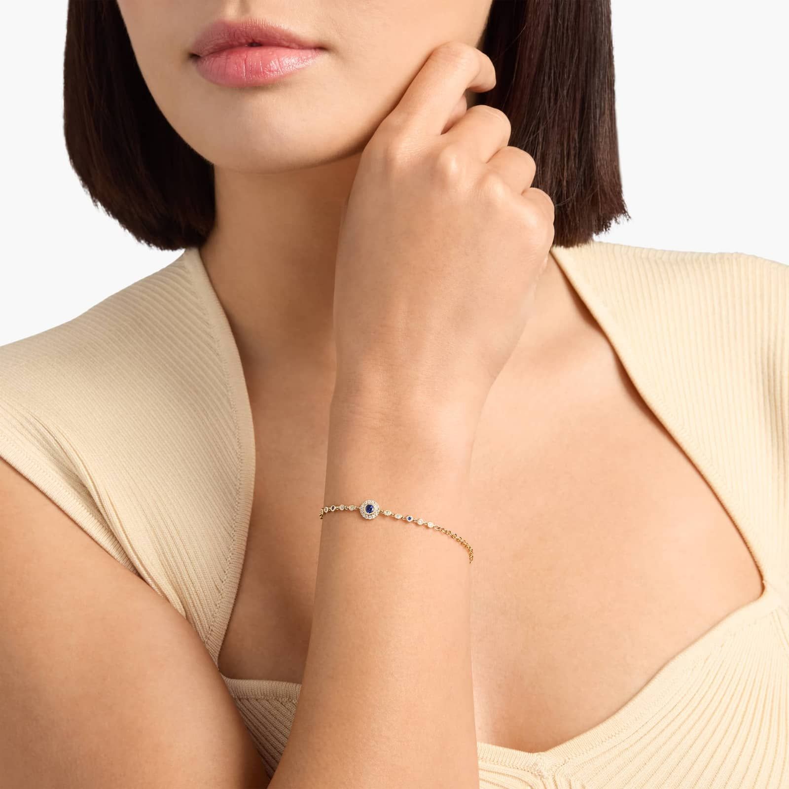 Blue Sapphire and Diamond Halo Chain Bracelet in Yellow Gold