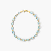 Oval Blue Topaz Tennis Bracelet in Yellow Gold