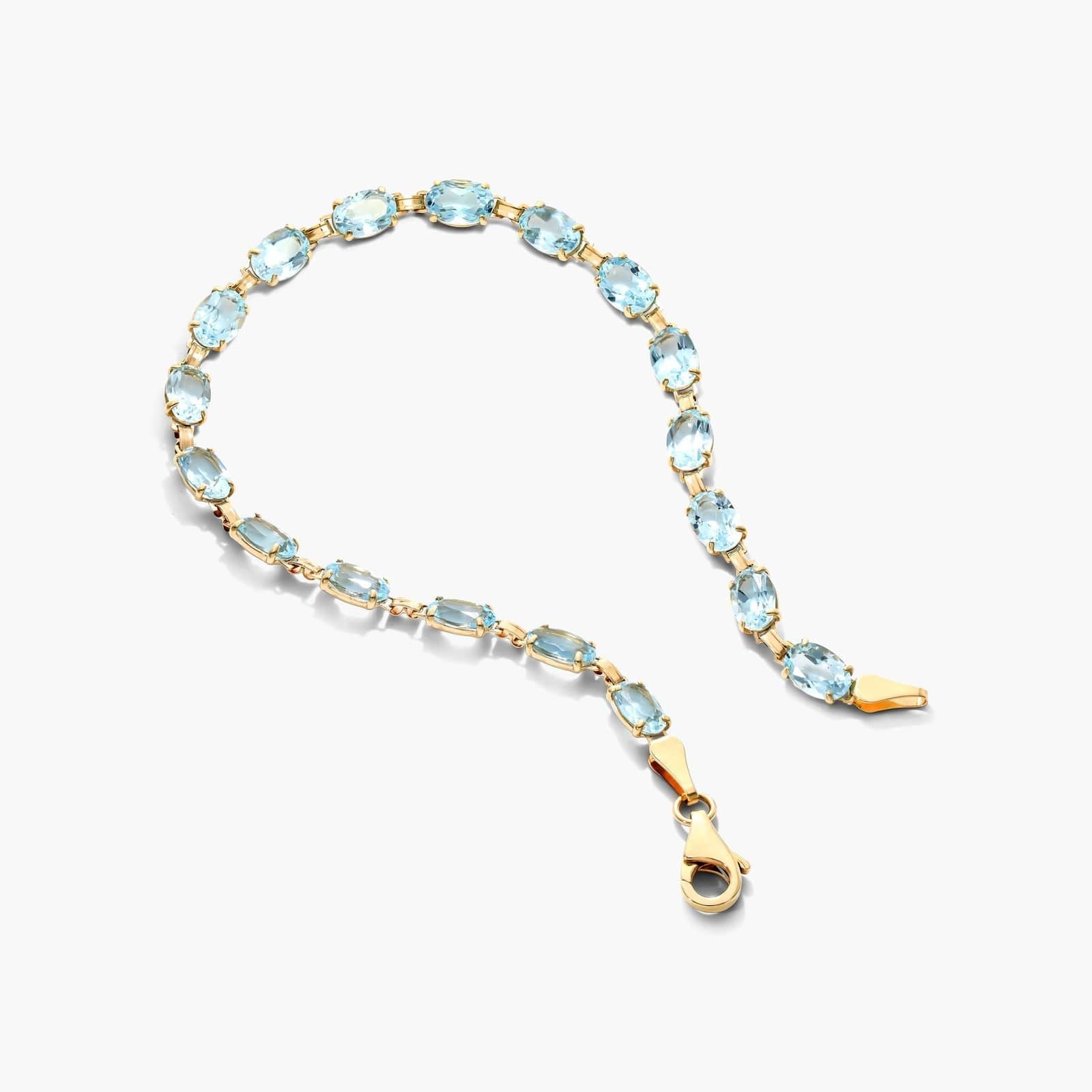 Oval Blue Topaz Tennis Bracelet in Yellow Gold