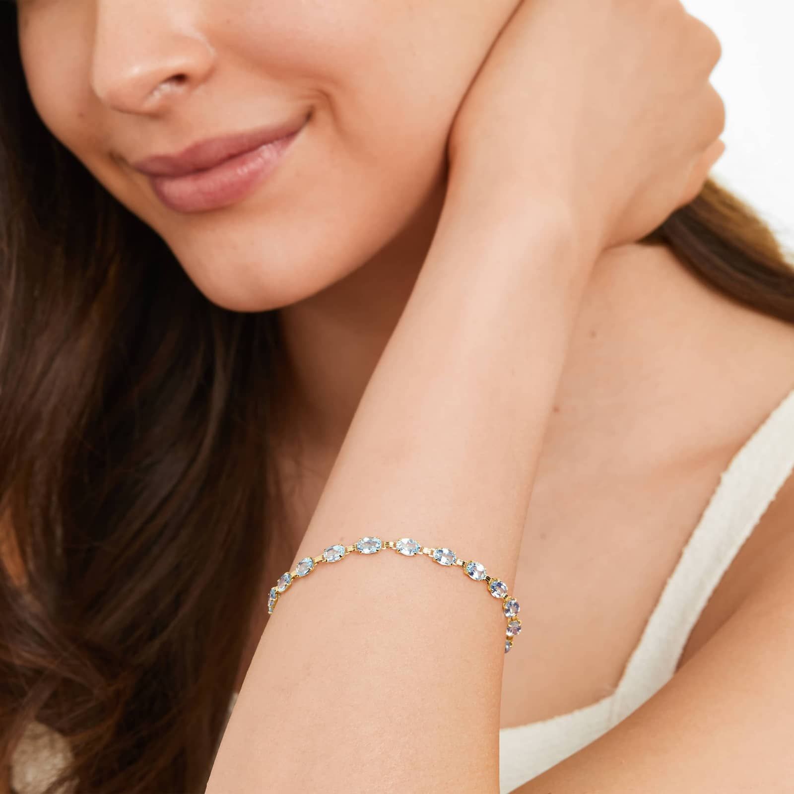 Oval Blue Topaz Tennis Bracelet in Yellow Gold