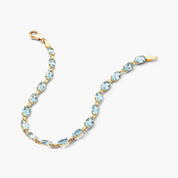 Oval Blue Topaz Tennis Bracelet in Yellow Gold