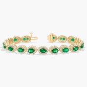 Oval Emerald and Diamond Halo Tennis Bracelet in Yellow Gold