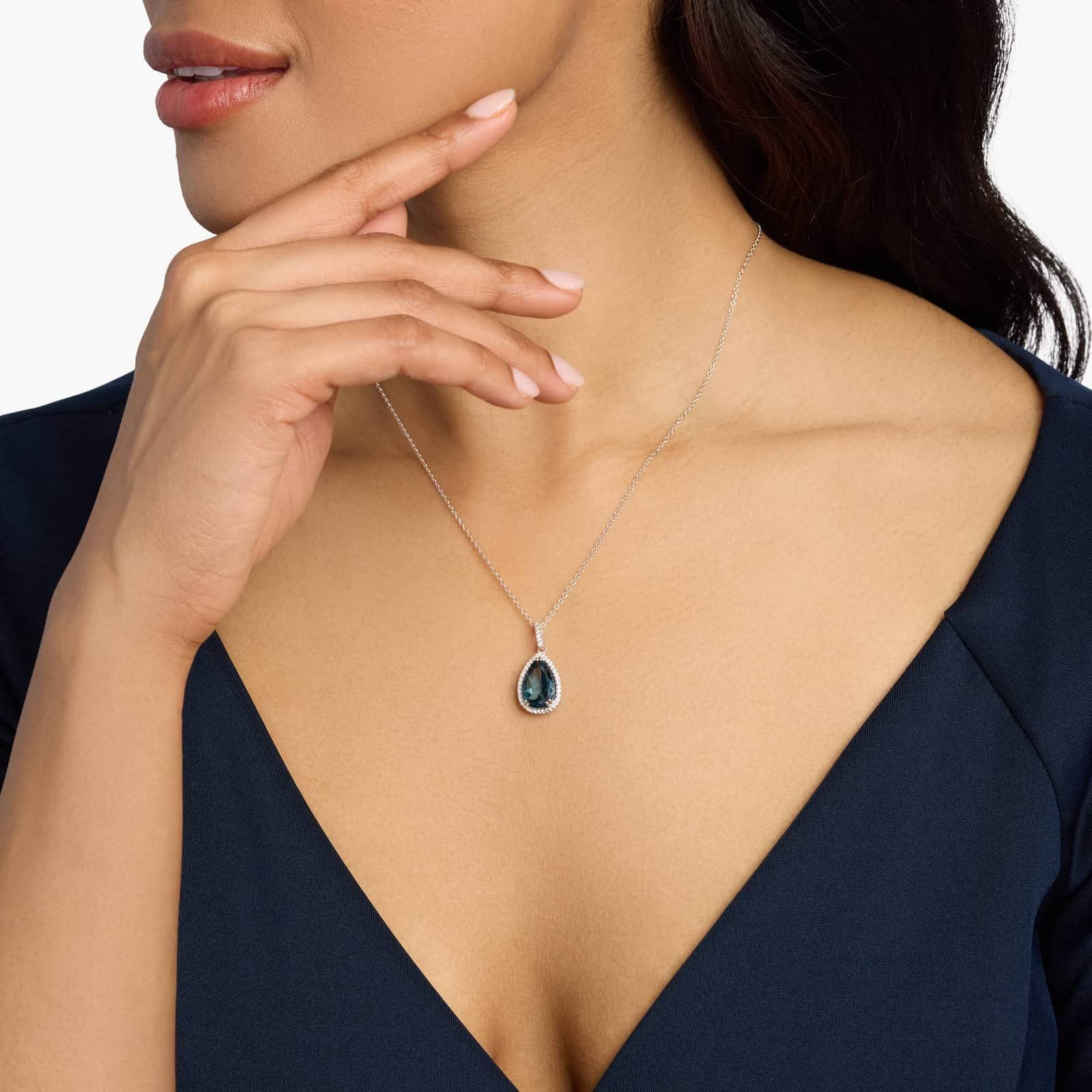 Sterling Silver Pear Blue Topaz Halo Pendant Necklace
